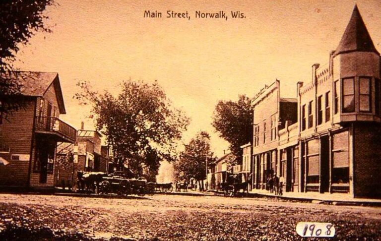 Historical commercial business store fronts lining early dirt Main Street corridors