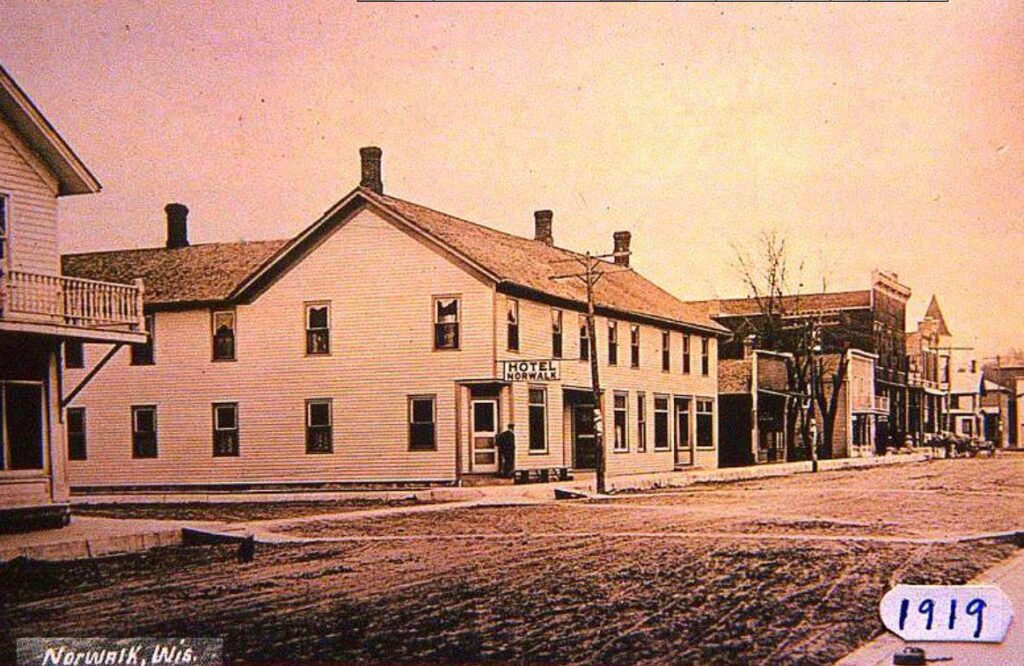 Archival architectural photo framing the brick facade of Hotel Norwalk